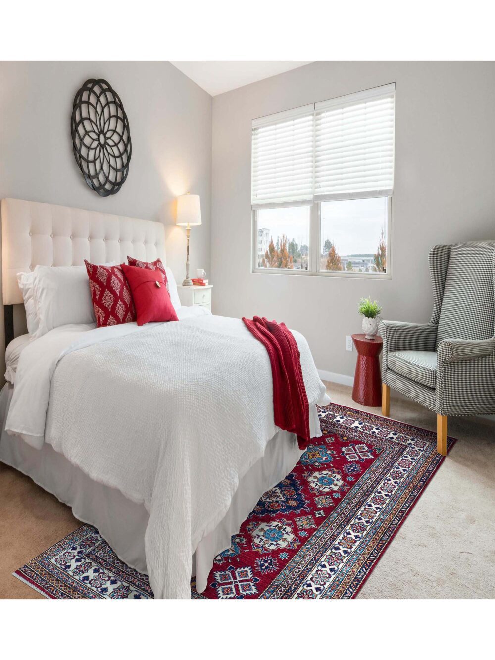 A stylish bedroom showcasing a 5 x 6 super kazzak rug in red and white, adding a pop of color to the space.