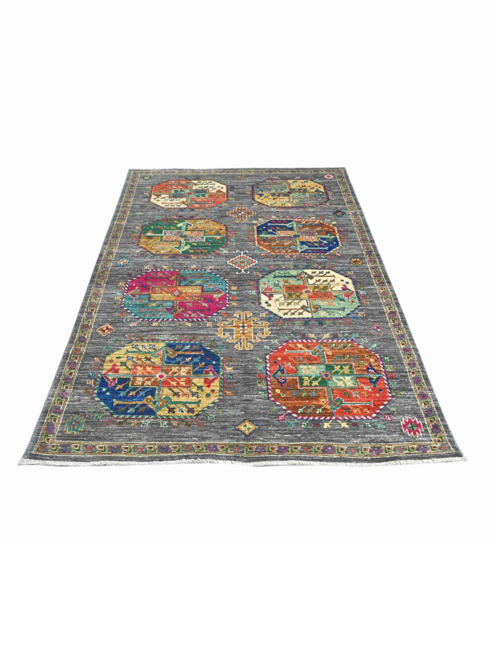 Colorful Ensari rug, size 6' x 4', featuring intricate geometric patterns and vibrant octagonal medallions, perfect for adding a touch of elegance to a living room