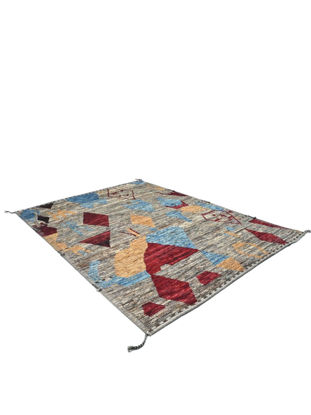 Moroccan rug 9 x 7 rug a mix of geometric shapes and abstract motifs. Its palette of muted earth tones, punctuated with vibrant reds, blues, and yellows, gives it a dynamic yet grounded feel