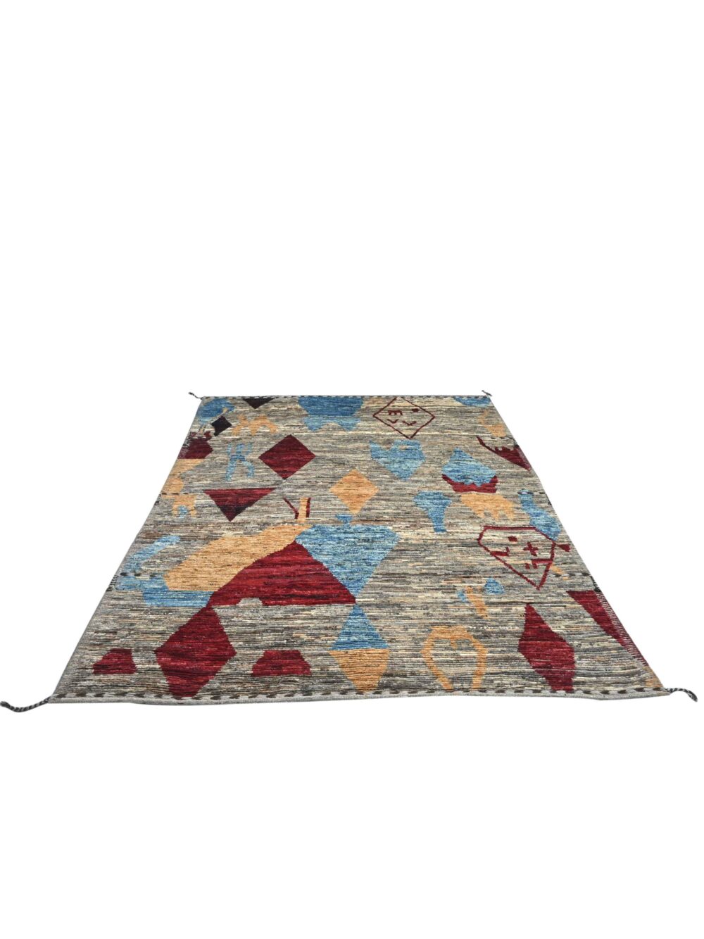 Moroccan rug 9 x 7 rug a mix of geometric shapes and abstract motifs. Its palette of muted earth tones, punctuated with vibrant reds, blues, and yellows, gives it a dynamic yet grounded feel