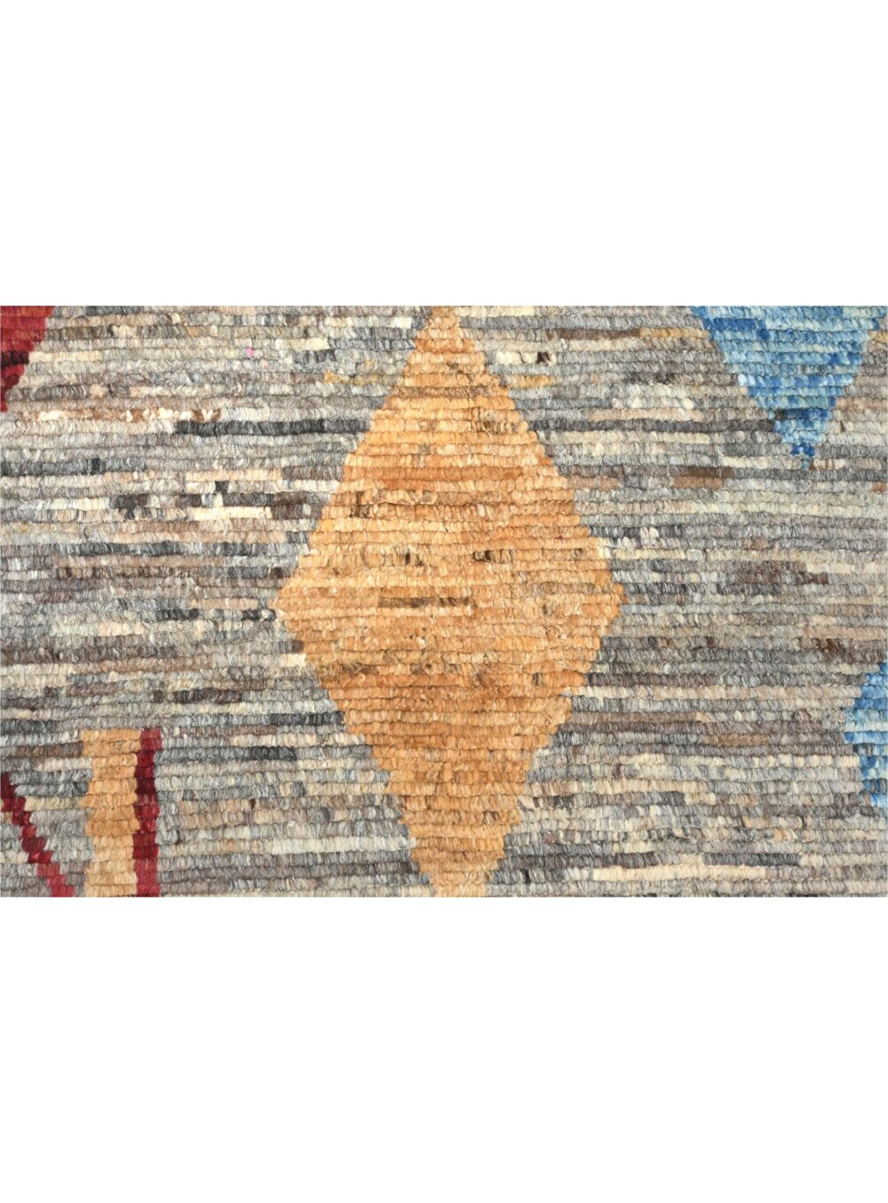 Moroccan rug 9 x 7 rug a mix of geometric shapes and abstract motifs. Its palette of muted earth tones, punctuated with vibrant reds, blues, and yellows, gives it a dynamic yet grounded feel