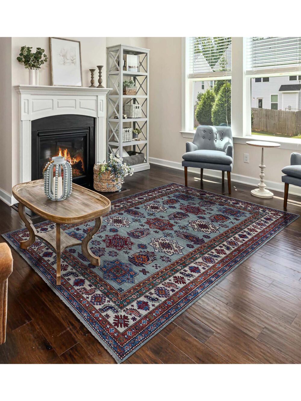 Supper kazzak 6 x 7 light blue rug adorned with red and blue geometric medallions, surrounded by intricate multicolored floral borders and patterns.