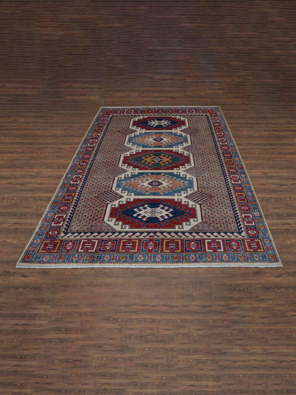 "White 6 x 8 rug with bold geometric patterns in red, blue, and beige, featuring intricate borders and vibrant central medallions."