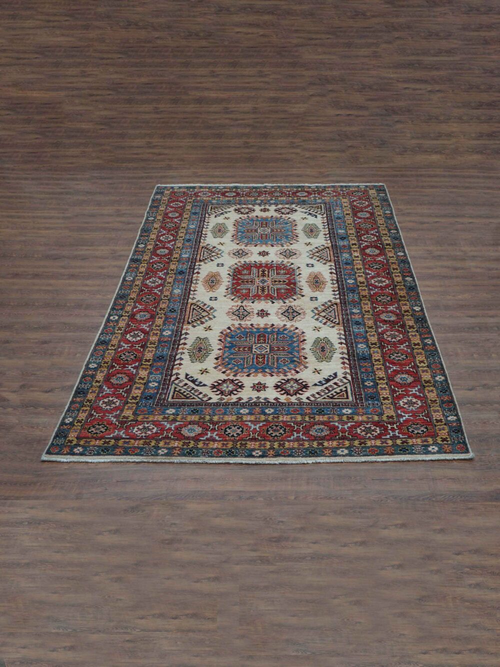 Super kazzak 6 x 8 beige rug with vibrant geometric and floral patterns, bordered by intricate multicolored designs, perfect for living spaces."