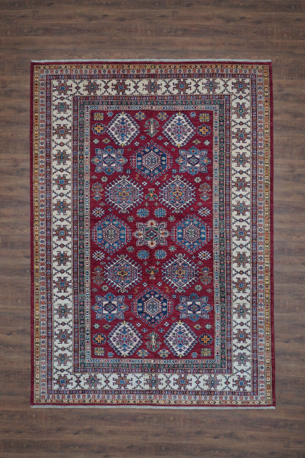 Super kazzak 5 x 8 Elegant red area rug with geometric and floral motifs, accented by white borders and intricate multicolored medallion patterns for decor. perfect rug for living room and any space large area rug