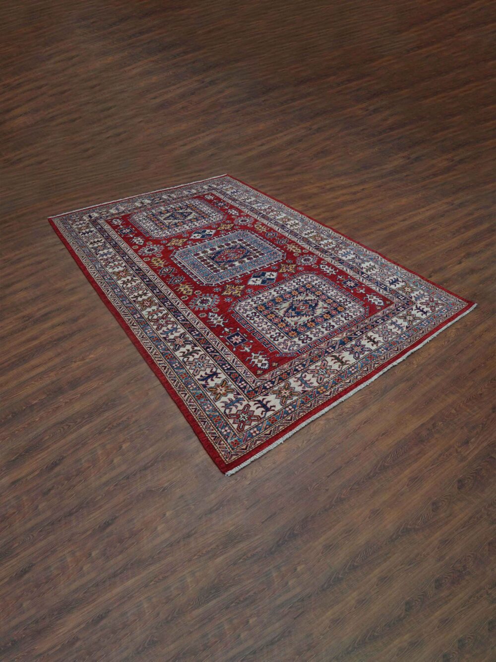 Super kazzak traditional 5x8 rug featuring a rich red background with detailed motifs in blue and white, framed by ornate floral and geometric borders, designed for use in a living room rug.