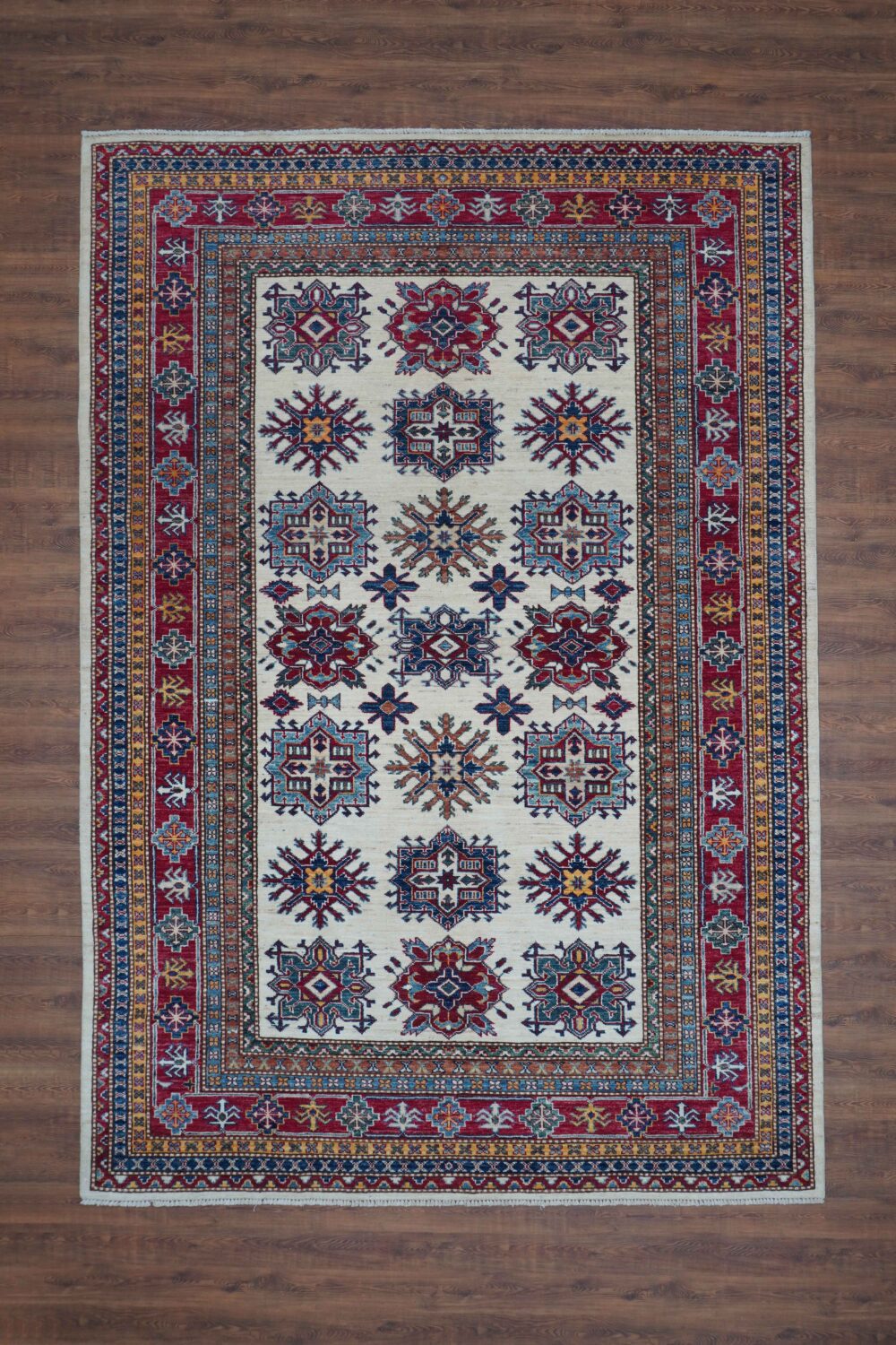 Supper kazzak 6 x 8 traditional blue rug with intricate geometric and floral patterns, vibrant colors, and detailed borders. A perfect centerpiece for any decor.