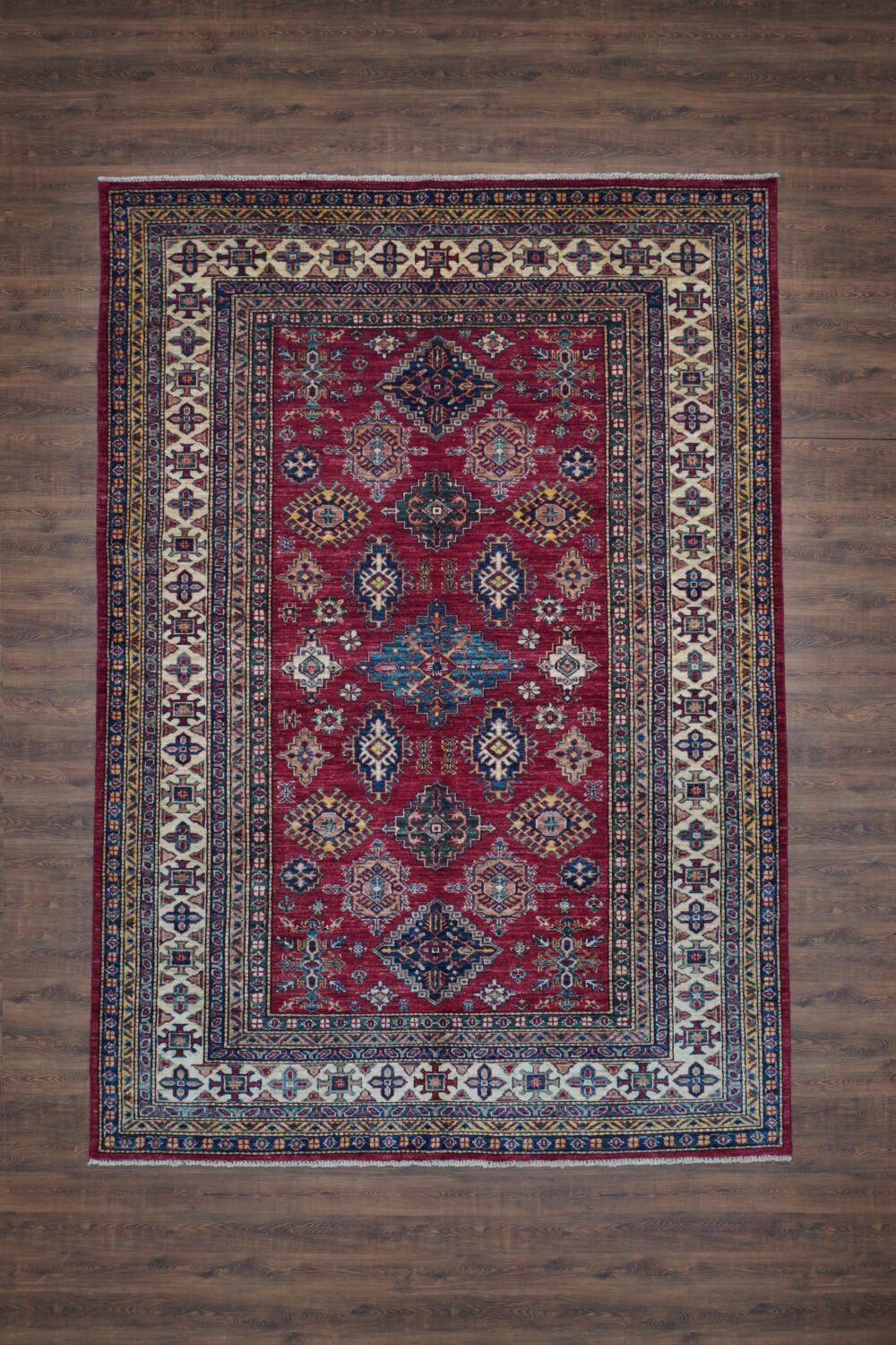 Super kazzak 6 x 8 beautifully patterned red and blue oriental rug, highlighting its artistry and color.