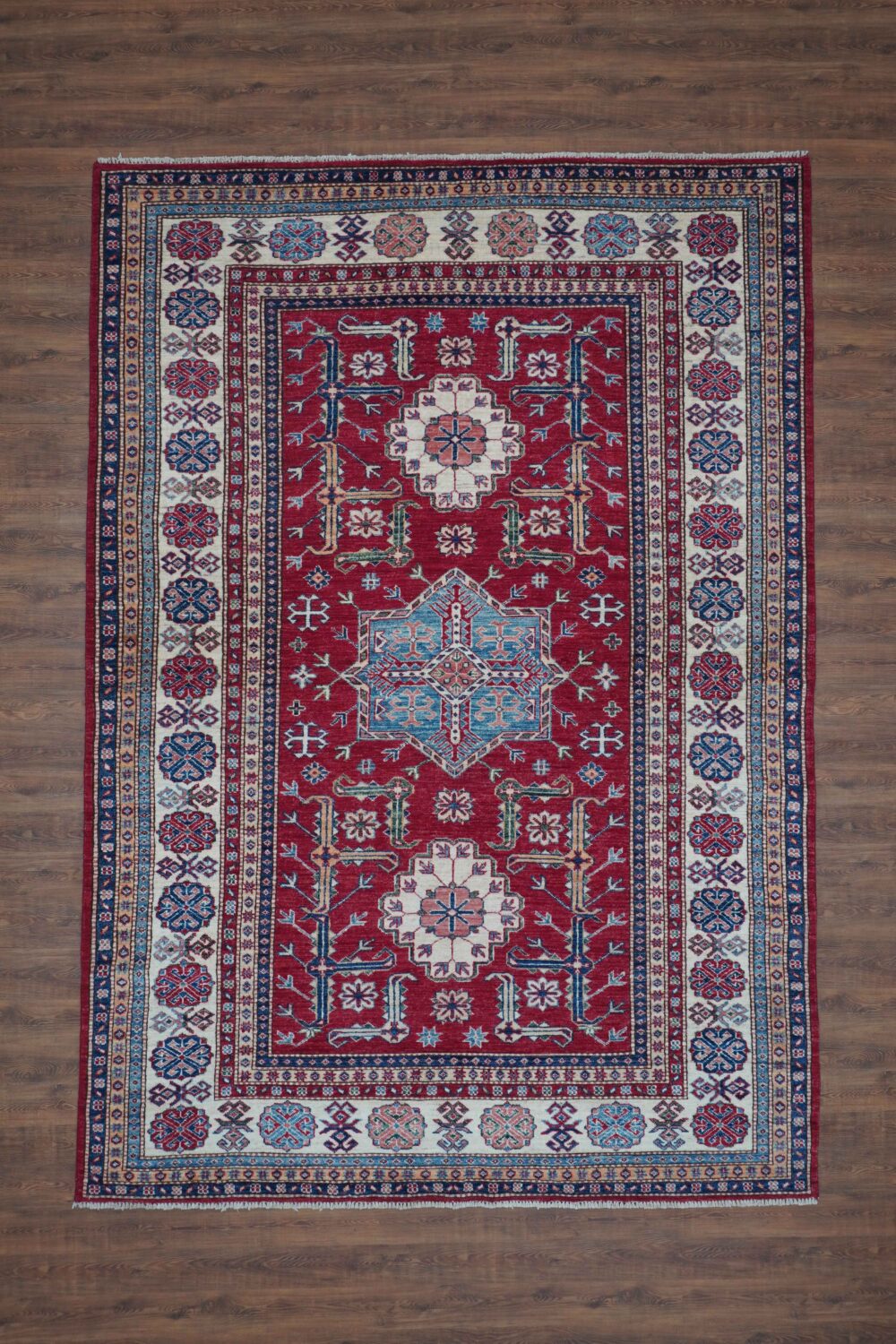 Super kazzak 7 x 8 beautifully patterned red and blue oriental rug, highlighting its artistry and color.